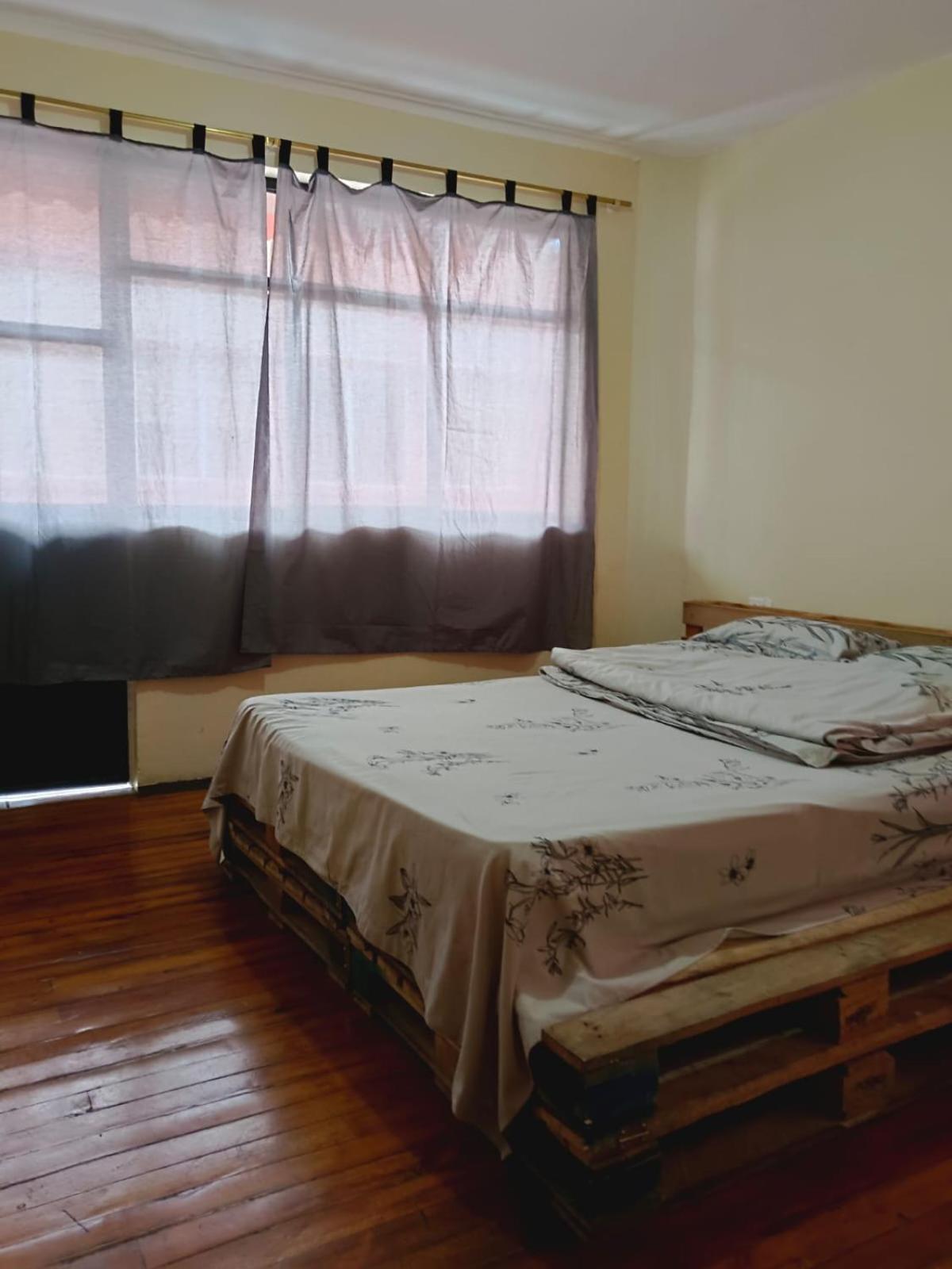 Quarto em Acomodações Particulares Camry Backpackers佳美背包客旅馆 Cuenca
